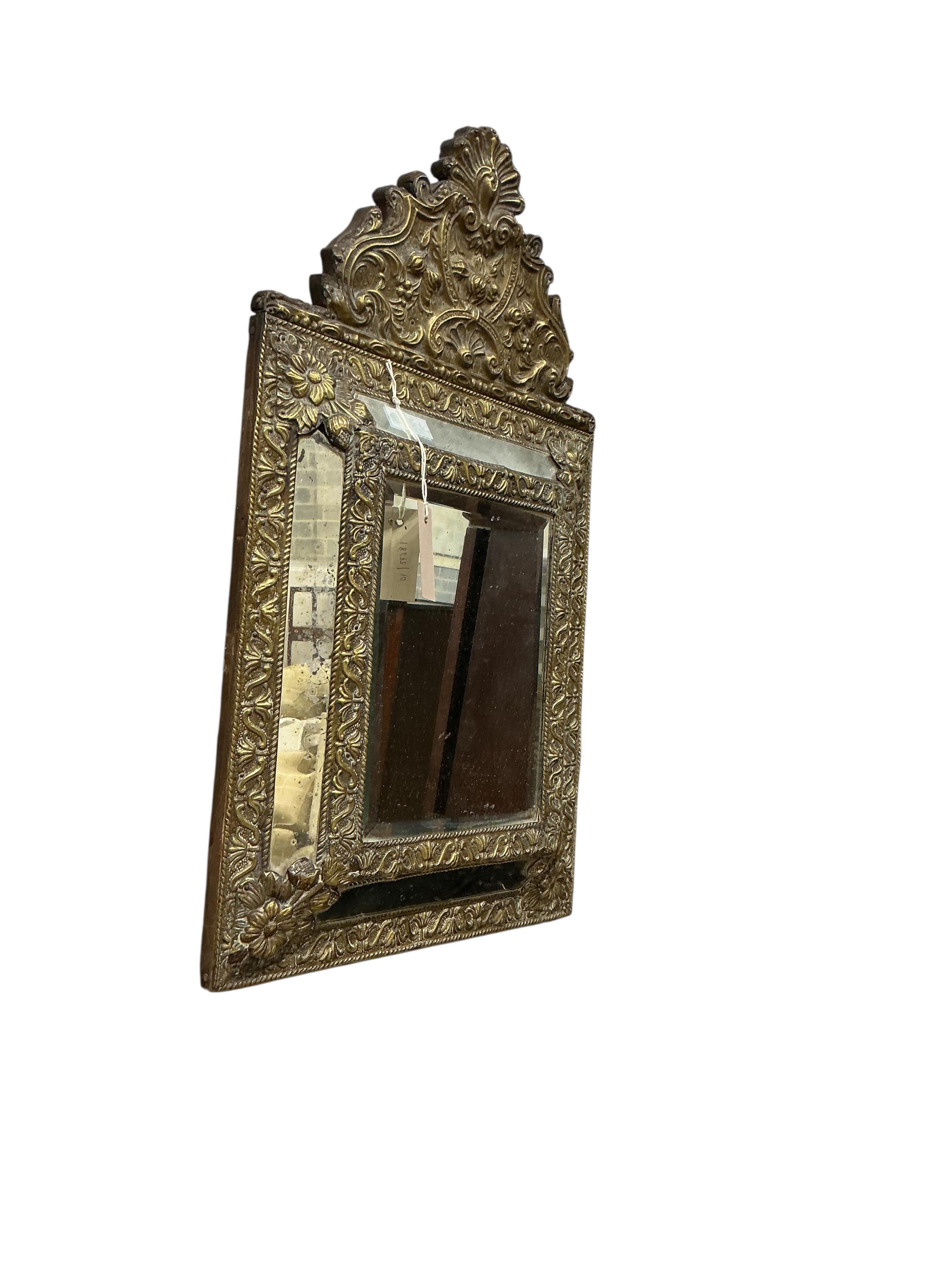 A small 19th century French embossed brass wall mirror, width 38cm, height 64cm